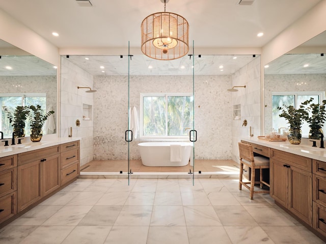 bathroom featuring vanity, separate shower and tub, and tile walls