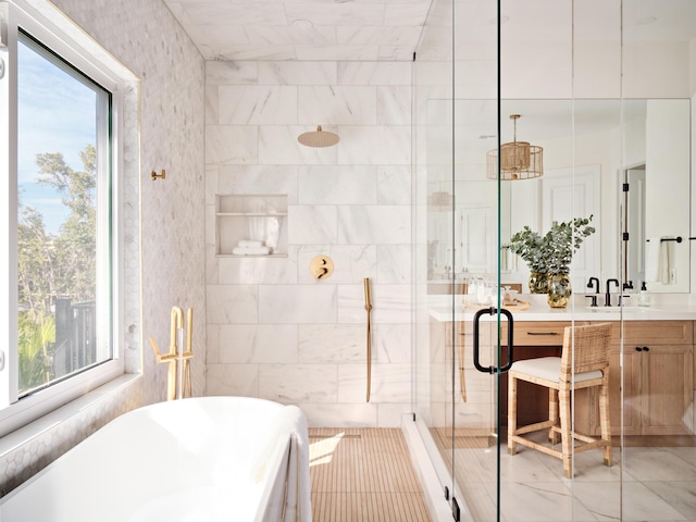 bathroom featuring vanity, plus walk in shower, and tile walls