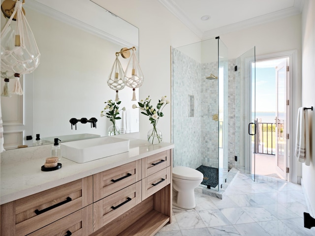 bathroom with ornamental molding, walk in shower, vanity, and toilet