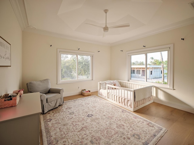 bedroom featuring baseboards, multiple windows, and crown molding