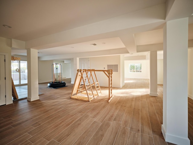 interior space featuring hardwood / wood-style flooring and a healthy amount of sunlight