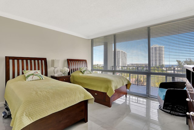 bedroom featuring crown molding and a textured ceiling