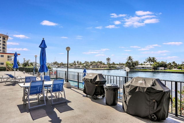 view of patio / terrace featuring a water view and area for grilling