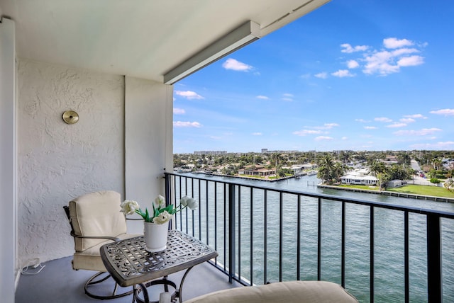 balcony featuring a water view