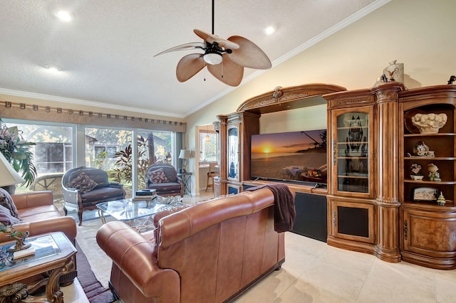 living room featuring ceiling fan, ornamental molding, vaulted ceiling, and light tile patterned flooring