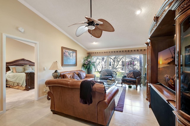 living room with baseboards, a ceiling fan, lofted ceiling, ornamental molding, and light tile patterned flooring