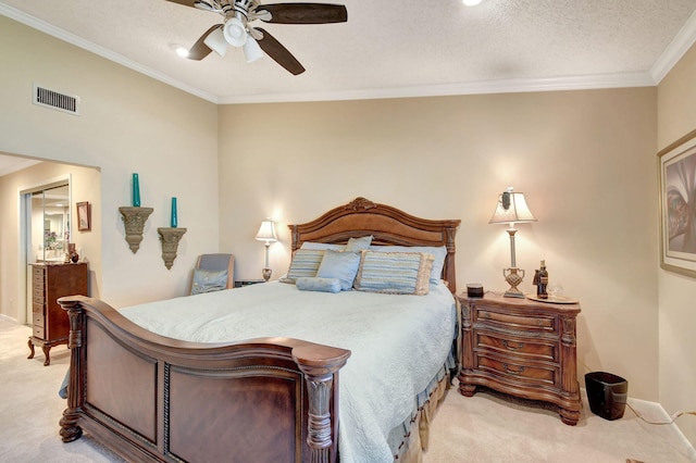 bedroom featuring crown molding, light colored carpet, visible vents, a textured ceiling, and baseboards