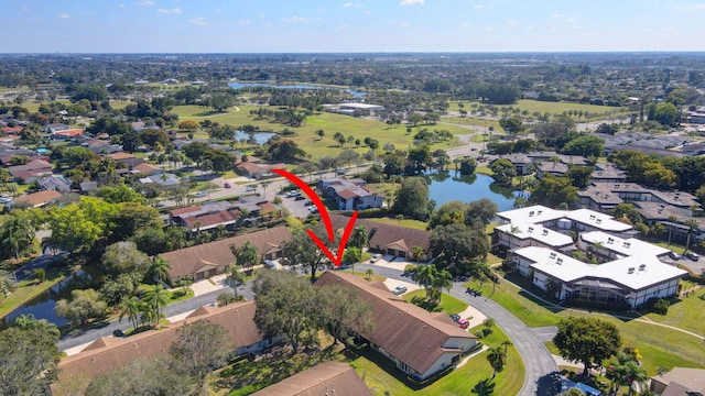 drone / aerial view featuring a residential view and a water view