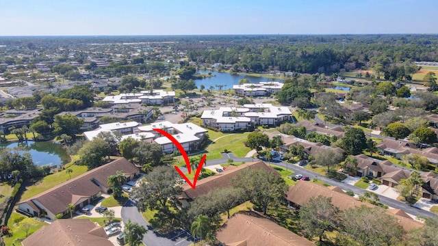 birds eye view of property featuring a residential view and a water view