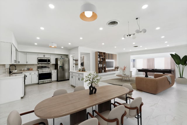 dining space featuring billiards and sink