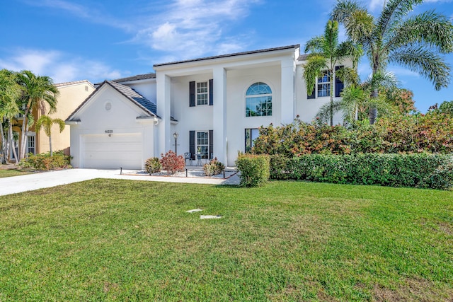 view of front of house featuring a garage and a front yard