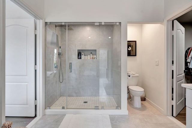 bathroom with toilet and walk in shower