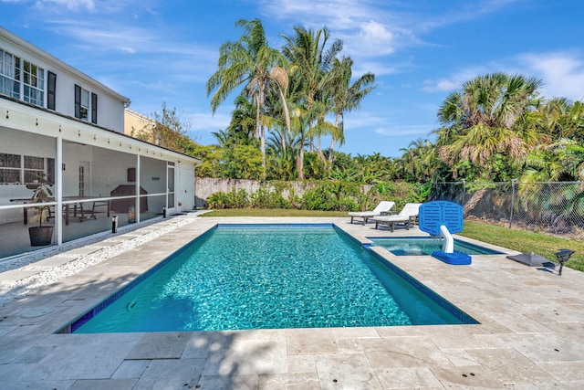 view of swimming pool with a patio