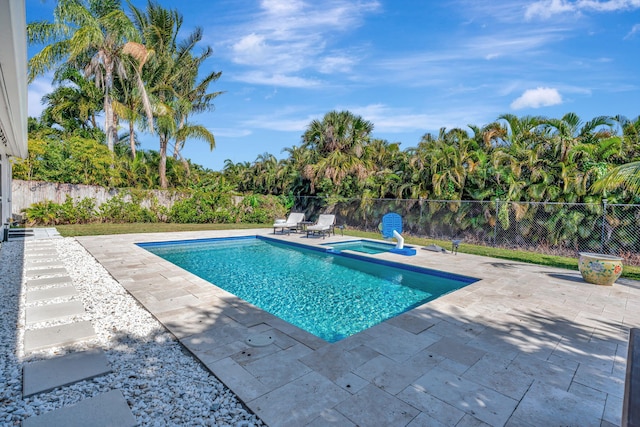 view of pool featuring a patio area