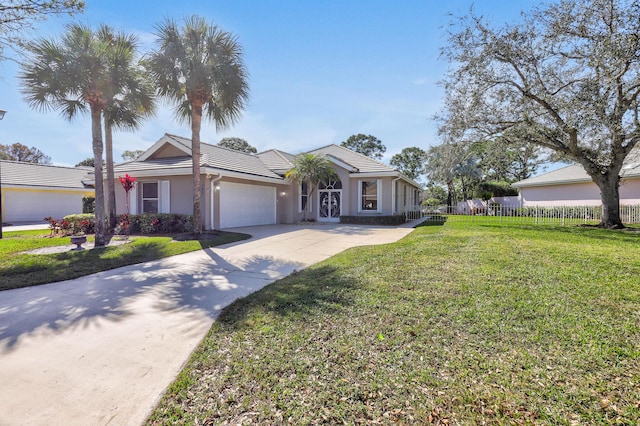 ranch-style house with a garage and a front yard