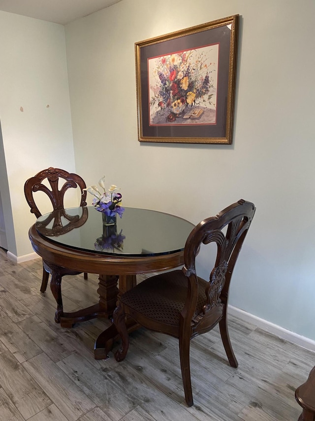 dining space with light wood-type flooring