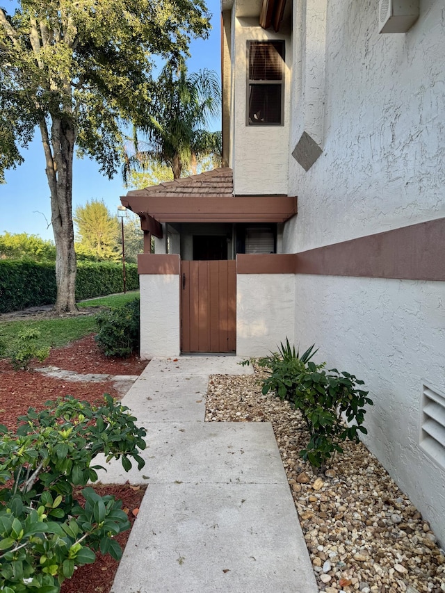 doorway to property with stucco siding