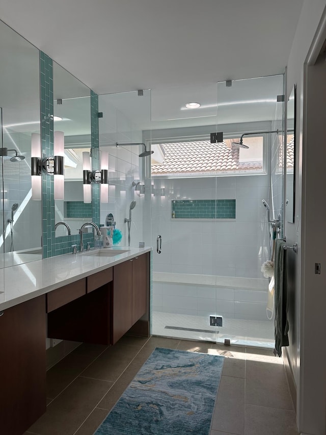 bathroom with vanity, tile patterned flooring, and walk in shower