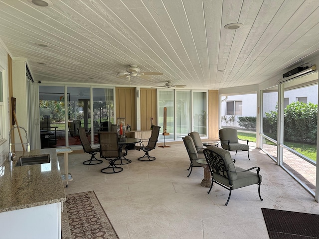 sunroom / solarium featuring sink and wooden ceiling