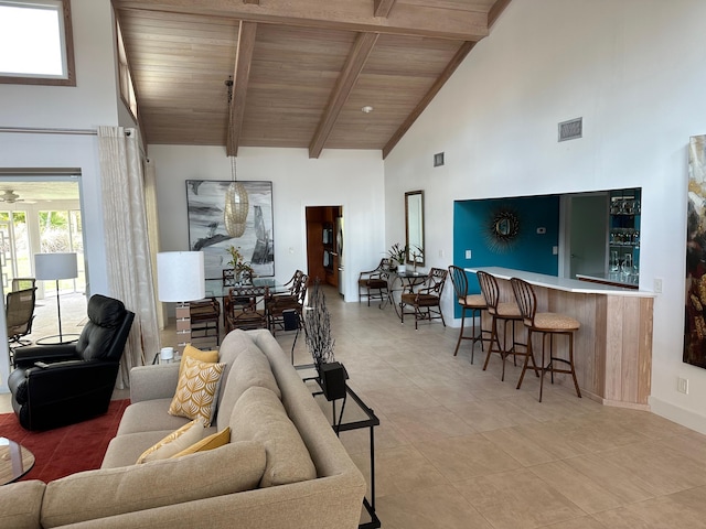 living room featuring high vaulted ceiling, beam ceiling, wooden ceiling, and bar area