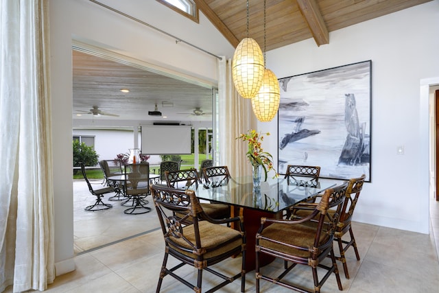 tiled dining area with vaulted ceiling with beams and wooden ceiling