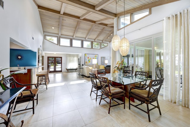 dining room with high vaulted ceiling, light tile patterned floors, wood ceiling, and french doors