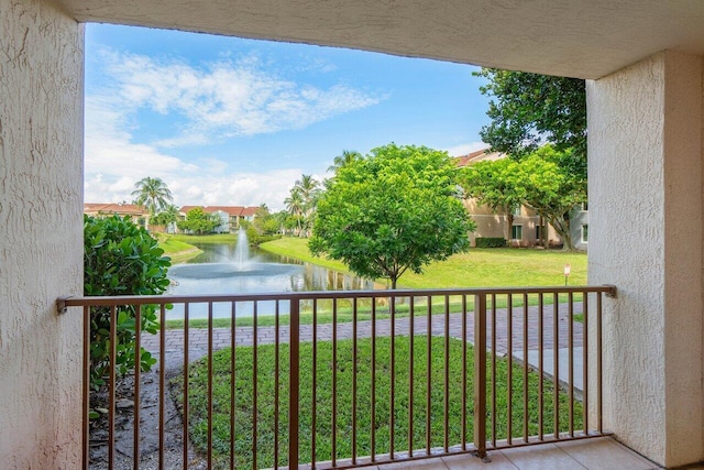 balcony featuring a water view