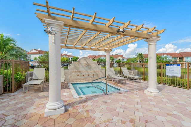 view of swimming pool featuring a hot tub, a patio, and a pergola