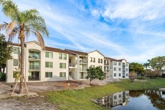 view of building exterior featuring a water view