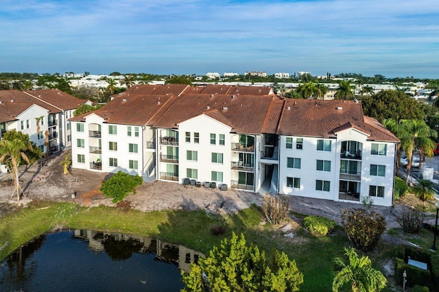 birds eye view of property with a water view