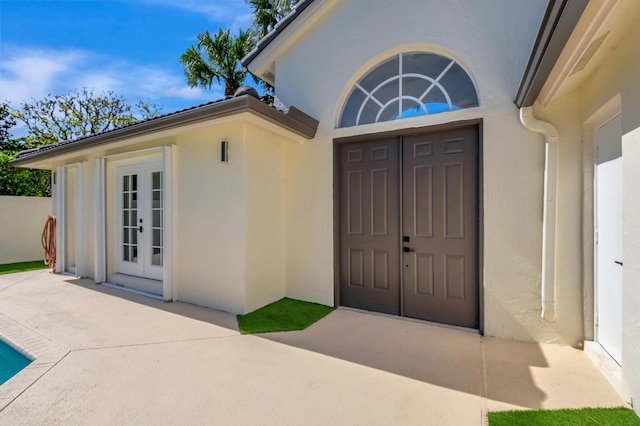 doorway to property featuring french doors and a patio