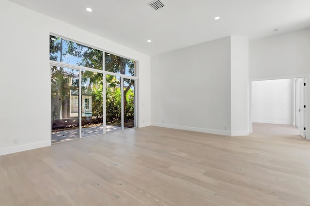 spare room with light hardwood / wood-style flooring