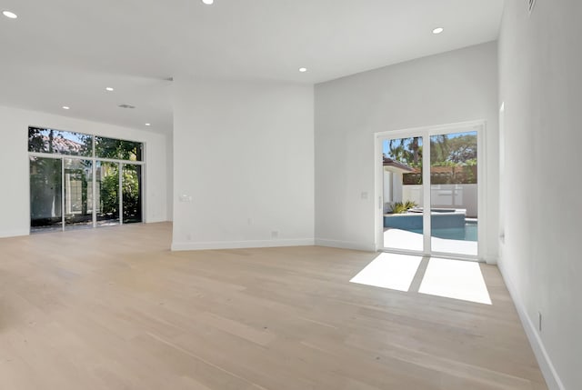 spare room with light hardwood / wood-style flooring