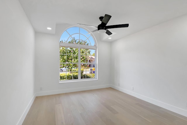 spare room with ceiling fan and light hardwood / wood-style floors