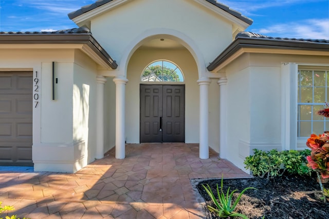 entrance to property featuring a garage