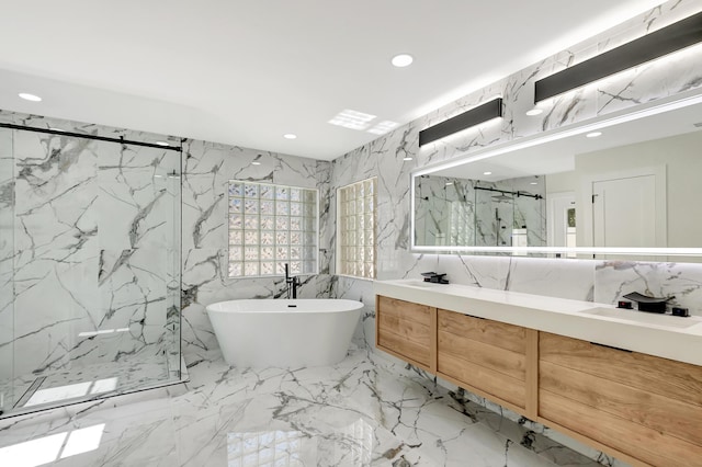 bathroom featuring vanity, tile walls, and separate shower and tub