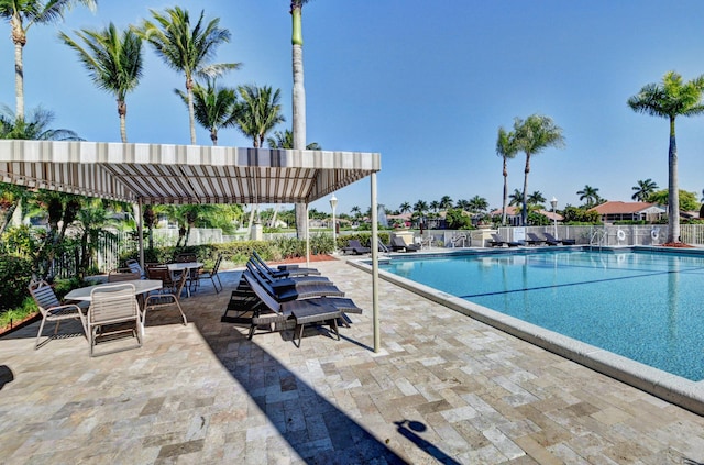 view of swimming pool featuring a pergola and a patio area