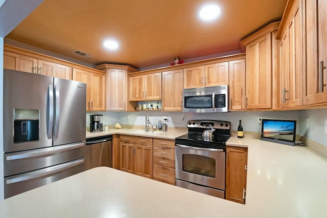 kitchen with appliances with stainless steel finishes and sink