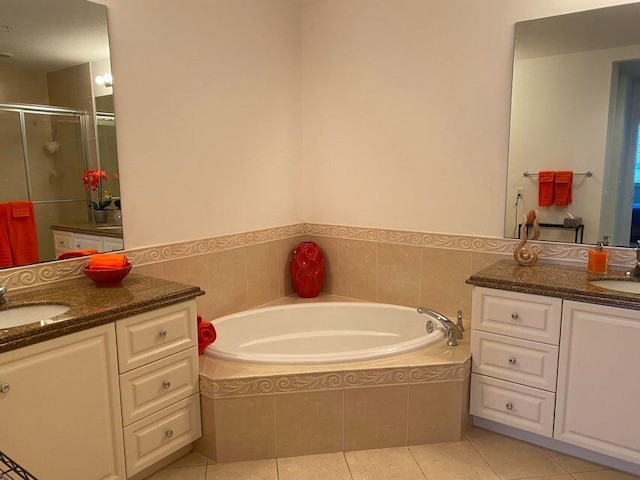 bathroom featuring vanity, separate shower and tub, and tile patterned floors