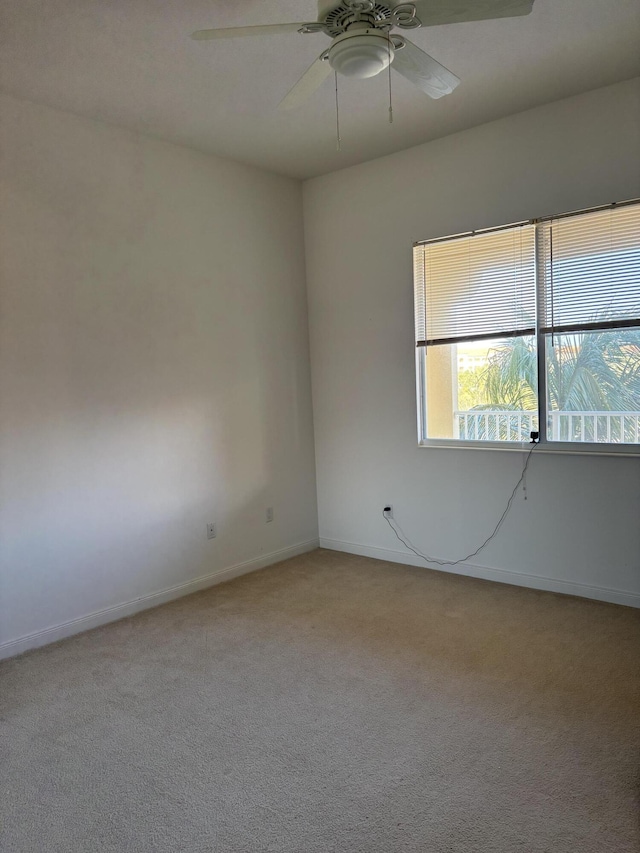 carpeted empty room with ceiling fan