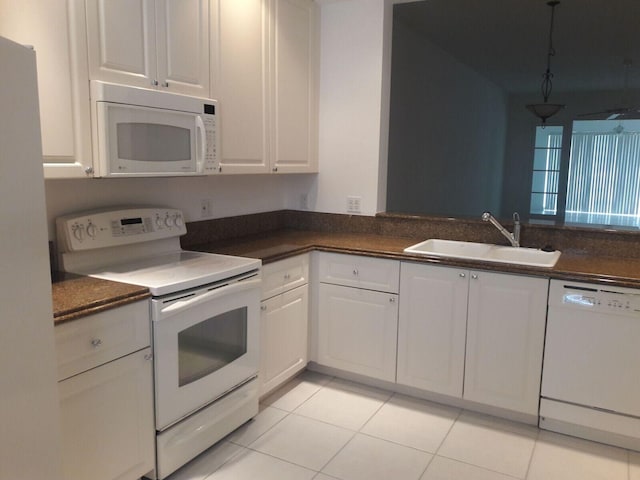 kitchen featuring light tile patterned flooring, pendant lighting, sink, white cabinets, and white appliances