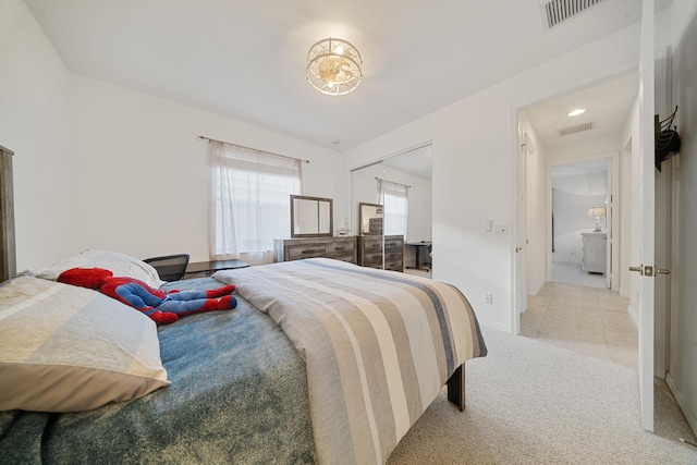 bedroom featuring light carpet