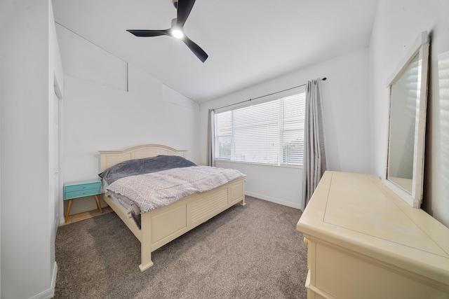 carpeted bedroom featuring ceiling fan and lofted ceiling