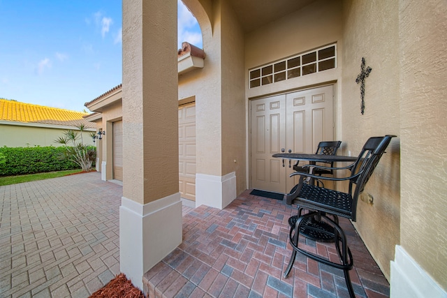 doorway to property with a garage