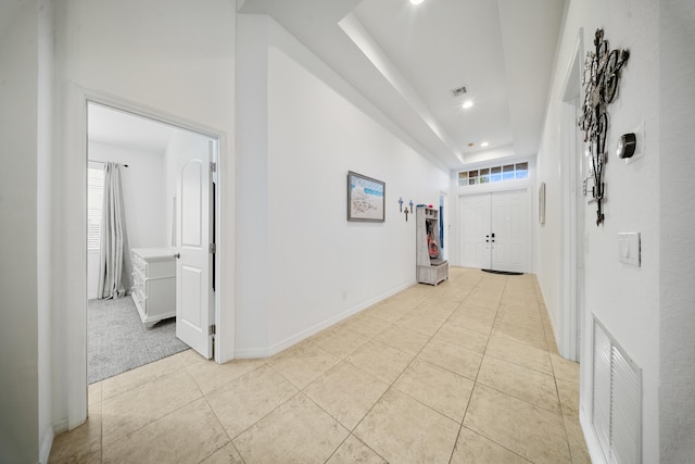 corridor with light tile patterned floors