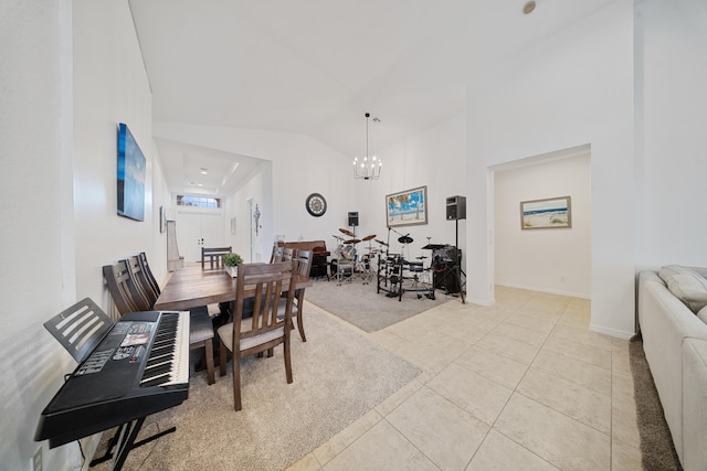 dining space featuring a notable chandelier, light tile patterned floors, and high vaulted ceiling