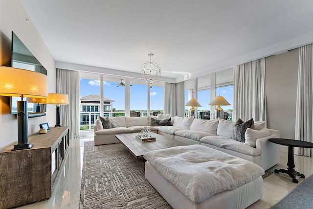 living room featuring a notable chandelier and plenty of natural light