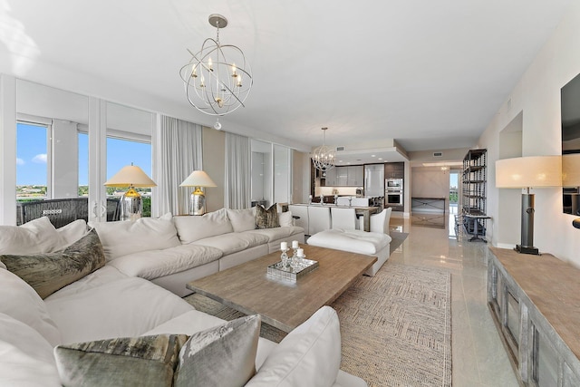 living room featuring an inviting chandelier and a wealth of natural light