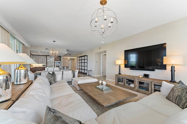 living room with an inviting chandelier