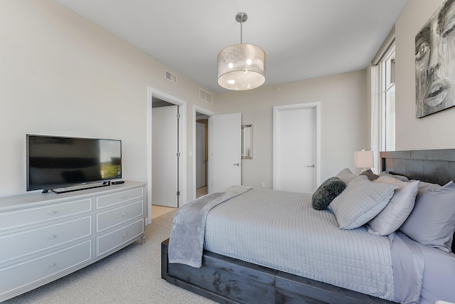 bedroom featuring light colored carpet